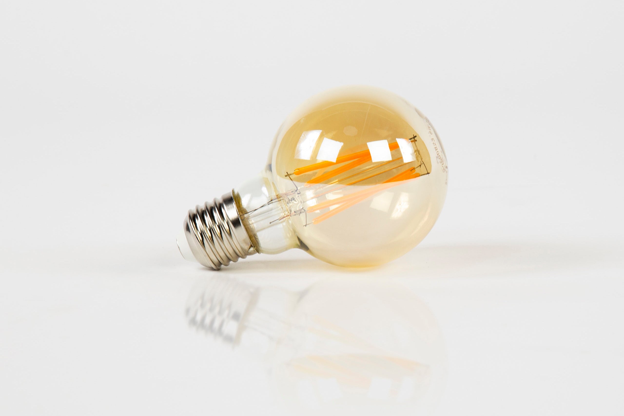 LED-Glühlampe Calyra – G70-E27 mit amberfarbenem Glas