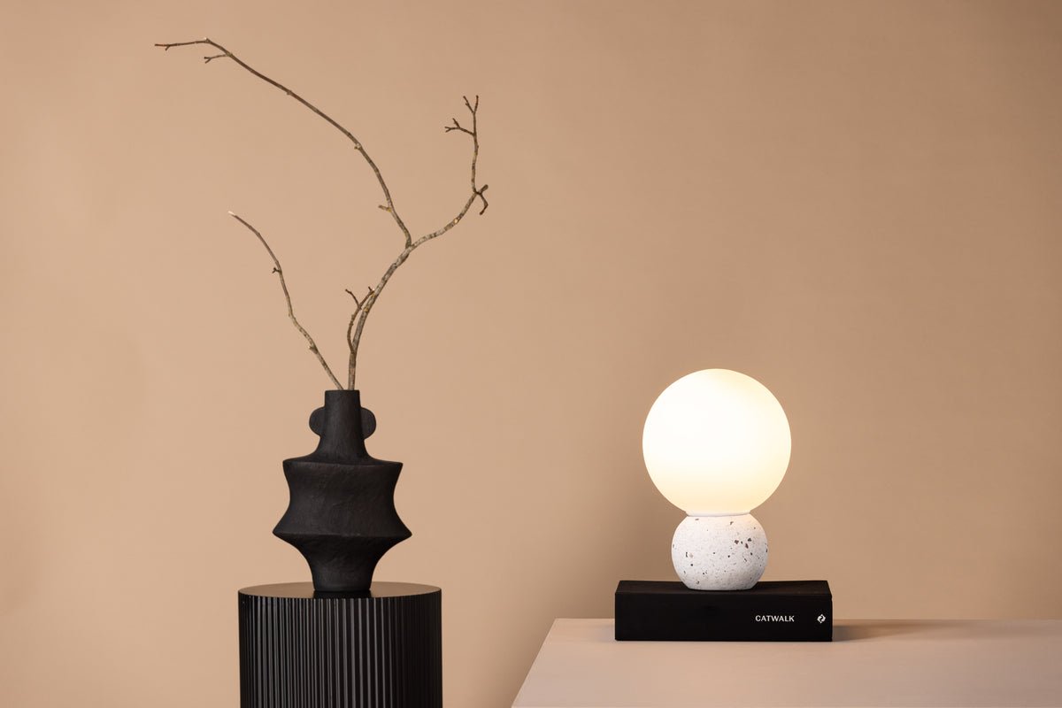 Table lamp "Bregenz" – base made of white terrazzo with dark accents