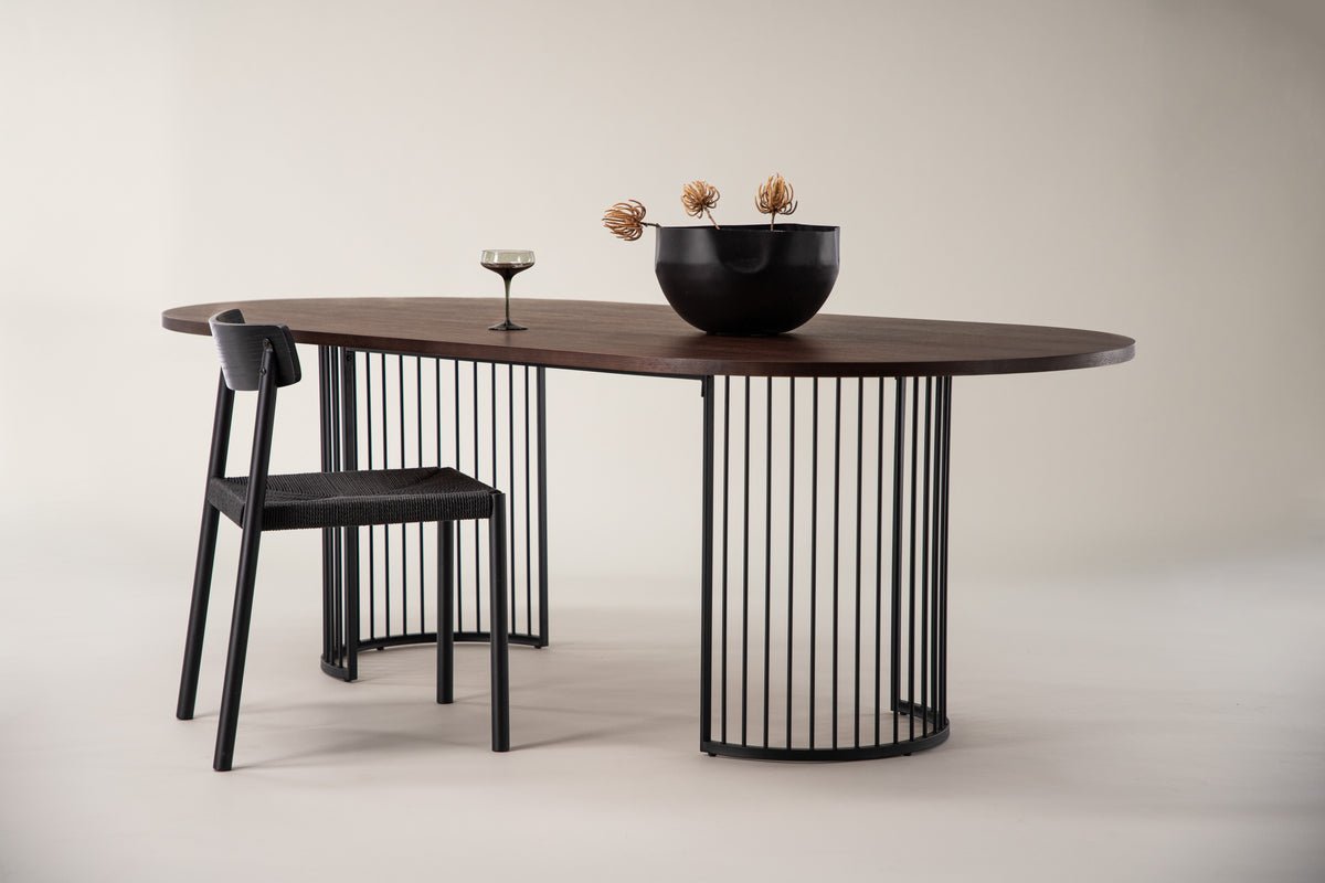 Manolo dining table - oval dining table with Black tabletop and walnut