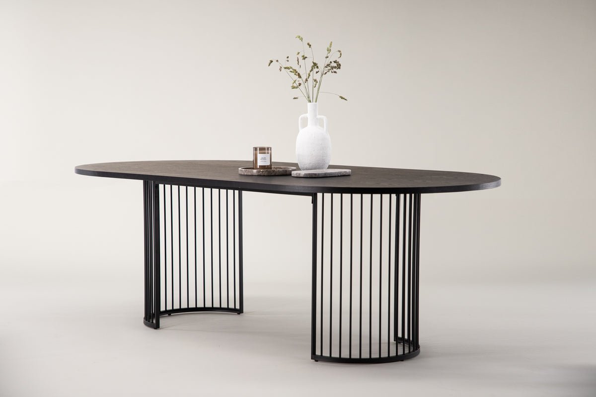 Manolo dining table - oval dining table with Black tabletop and walnut
