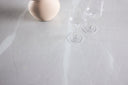 Dining table Orlén – Round design dining table Ø120 cm with glass top and ribbed base