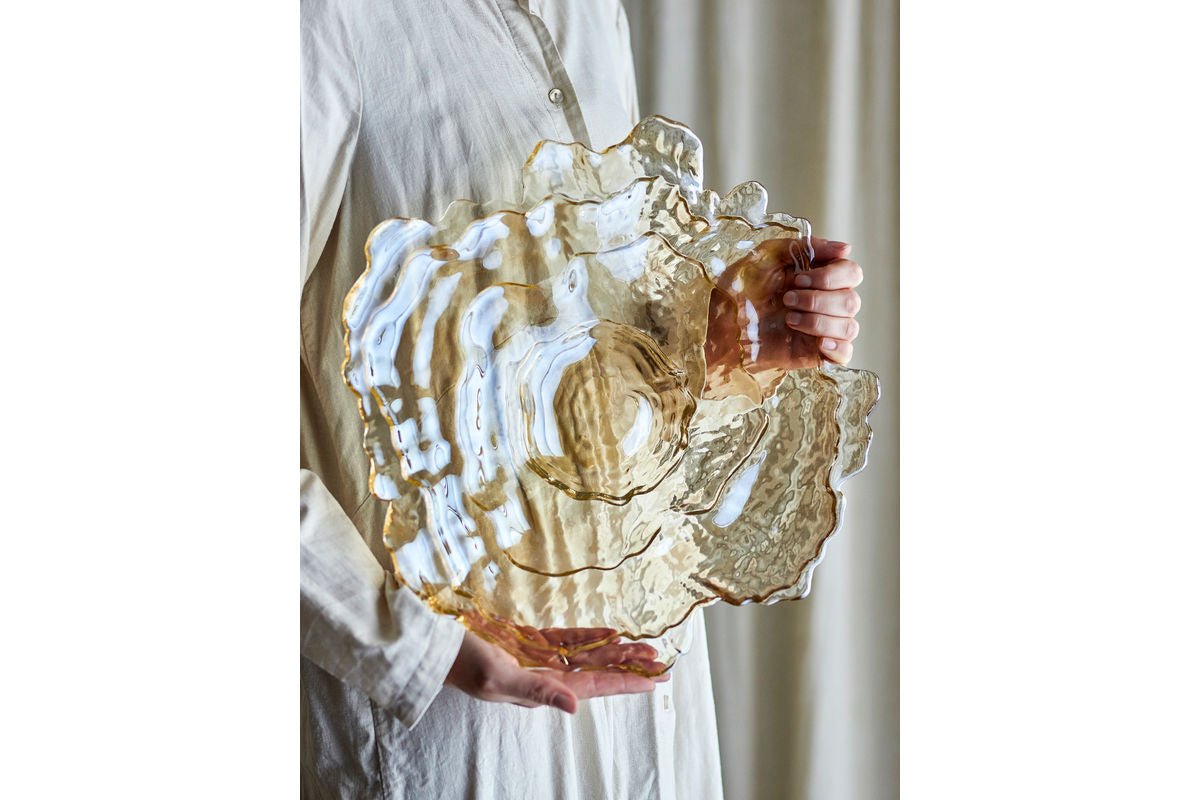 Bowl Amiri – made of glass in natural color with gentle wave shape