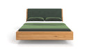 Designer wooden bed Cassian made of solid oak in a floating appearance