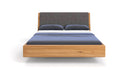 Designer wooden bed Cassian made of solid oak in a floating appearance