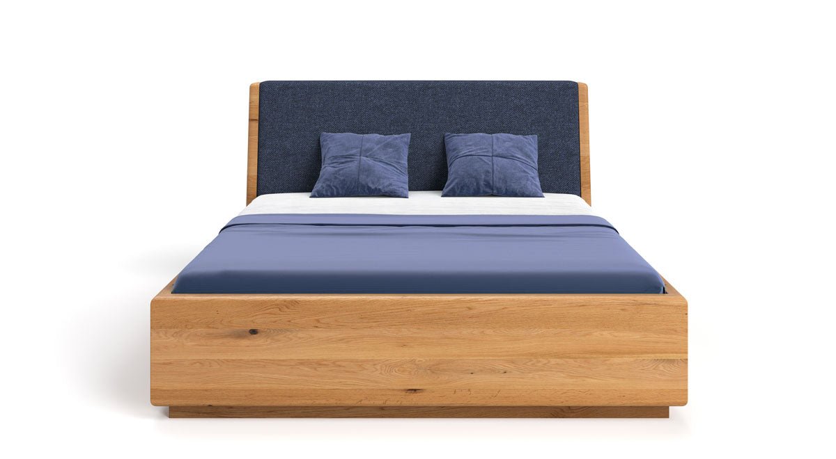 Designer wooden bed Cassian made of solid oak with storage space
