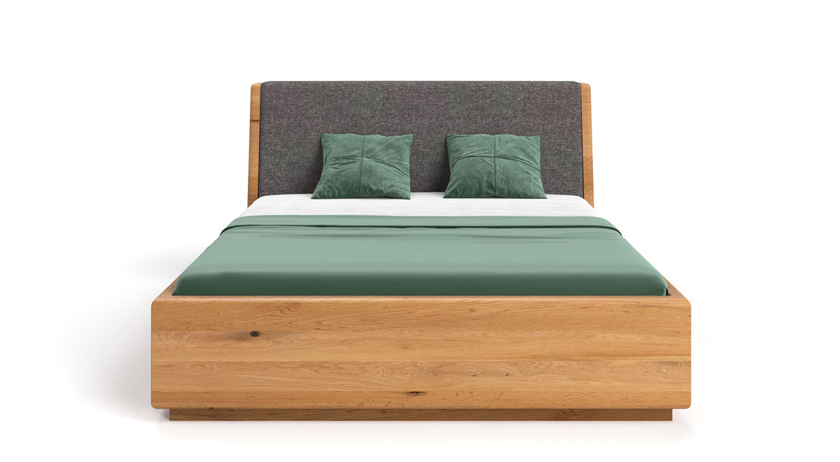 Designer wooden bed Cassian made of solid oak with storage space