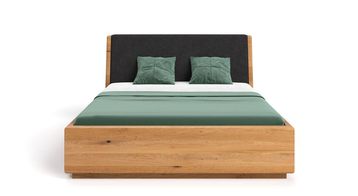 Designer wooden bed Cassian made of solid oak with storage space
