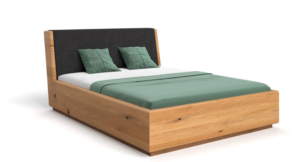 Designer wooden bed Cassian made of solid oak with storage space