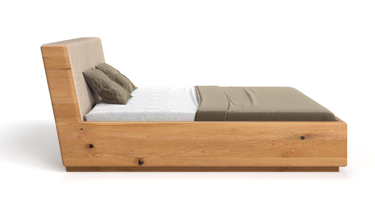 Designer wooden bed Cassian made of solid oak with storage space