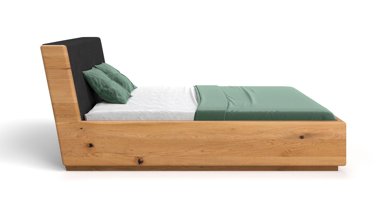 Designer wooden bed Cassian made of solid oak with storage space