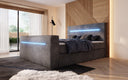 Boxspringbett Sejour mit TV Lift, RGB und Stauraum in Cord