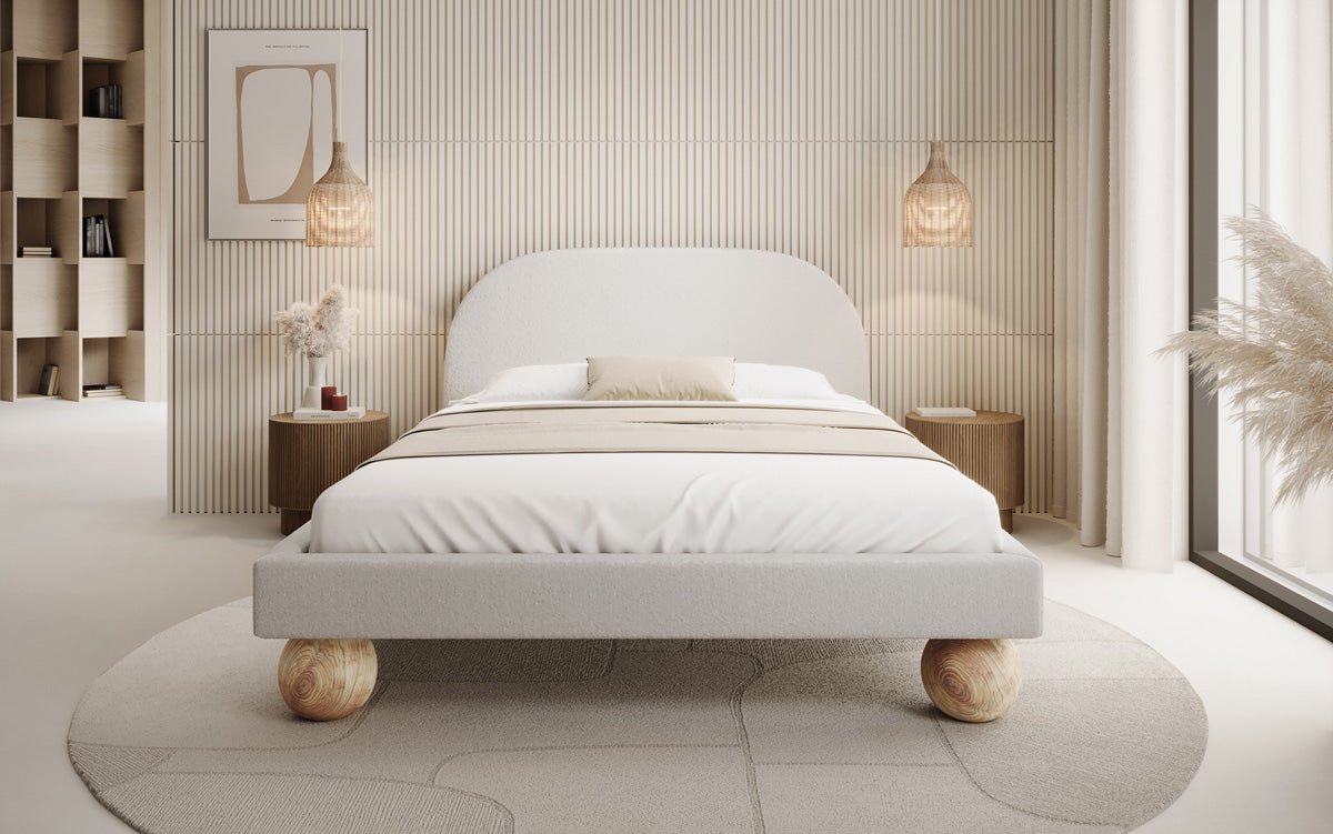 Designer upholstered bed Milo in bouclé with round wooden feet