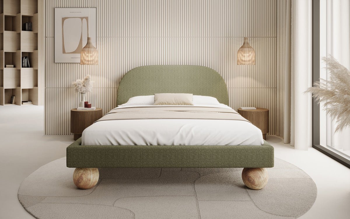 Designer upholstered bed Milo in bouclé with round wooden feet