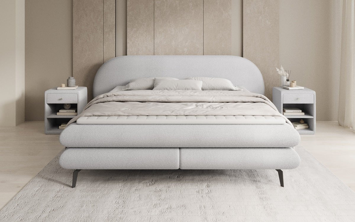 Box spring bed Marisol with oval headboard in bouclé