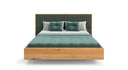 Designer wooden bed Valent made of solid oak in a floating appearance