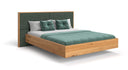 Designer wooden bed Valent made of solid oak in a floating appearance