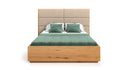 Designer wooden bed Valent made of solid oak with storage space