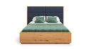 Designer wooden bed Valent made of solid oak with storage space