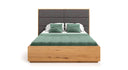 Designer wooden bed Valent made of solid oak with storage space