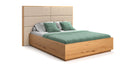 Designer wooden bed Valent made of solid oak with storage space