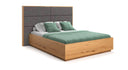Designer wooden bed Valent made of solid oak with storage space