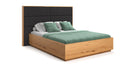 Designer wooden bed Valent made of solid oak with storage space
