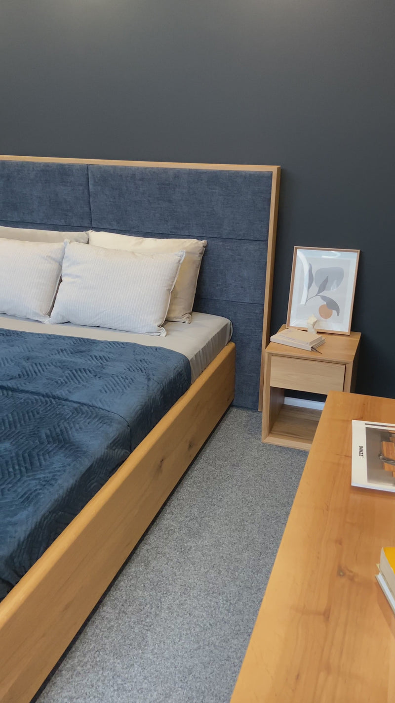 Designer wooden bed Valent made of solid oak with storage space