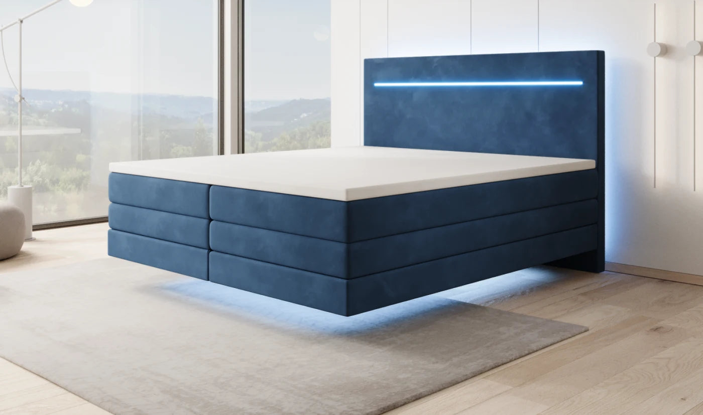 Floating box spring bed in blue velvet by day