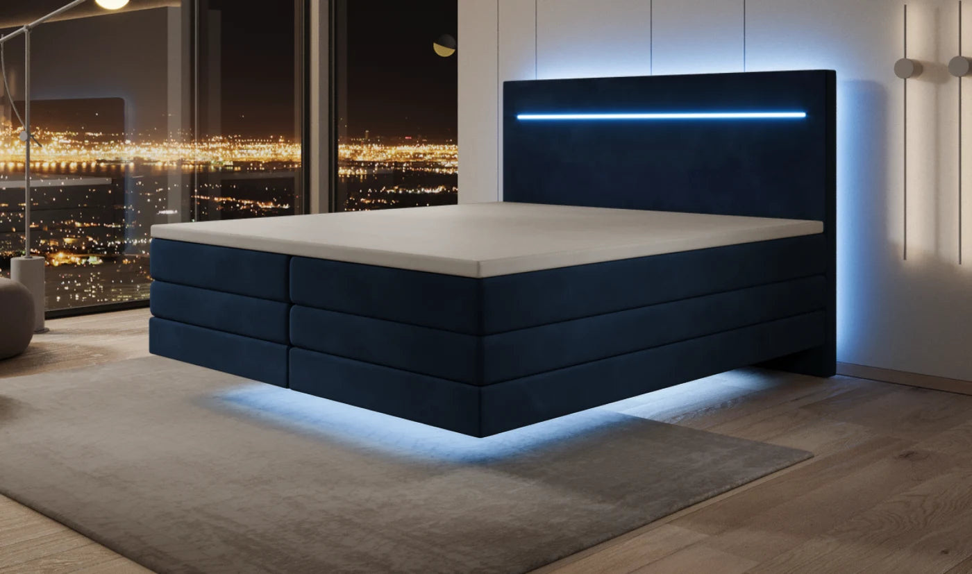 The same box spring bed at night with LED lighting